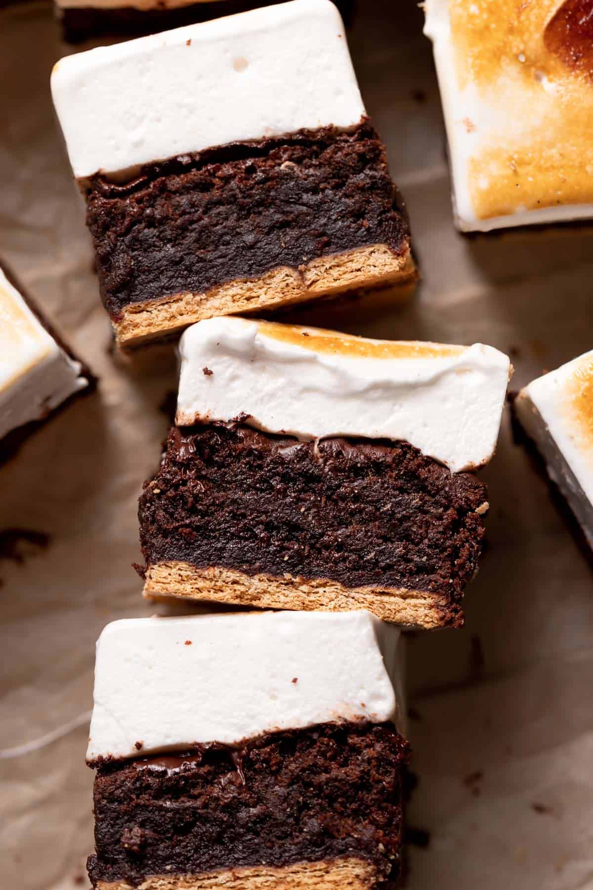 smores bars on their sides to show the layers.