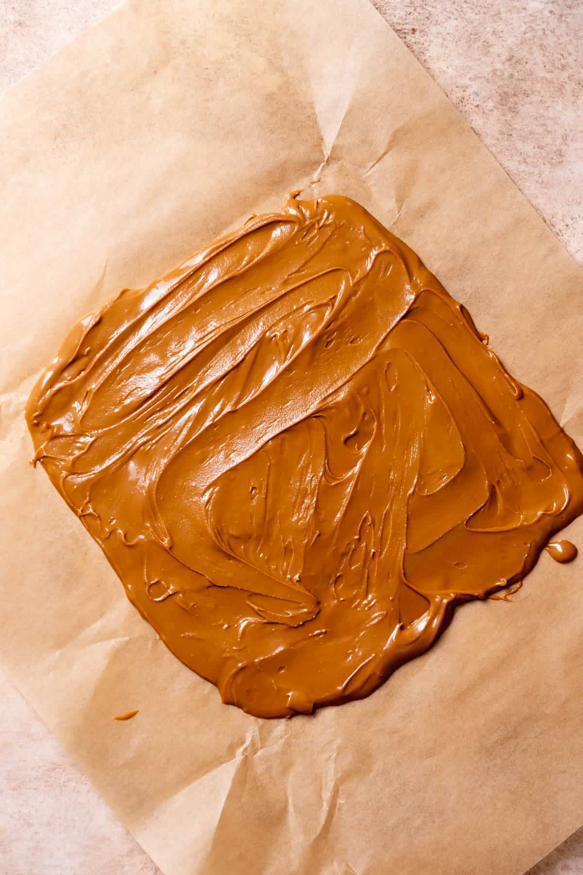 biscoff butter spread onto a piece of parchment paper.