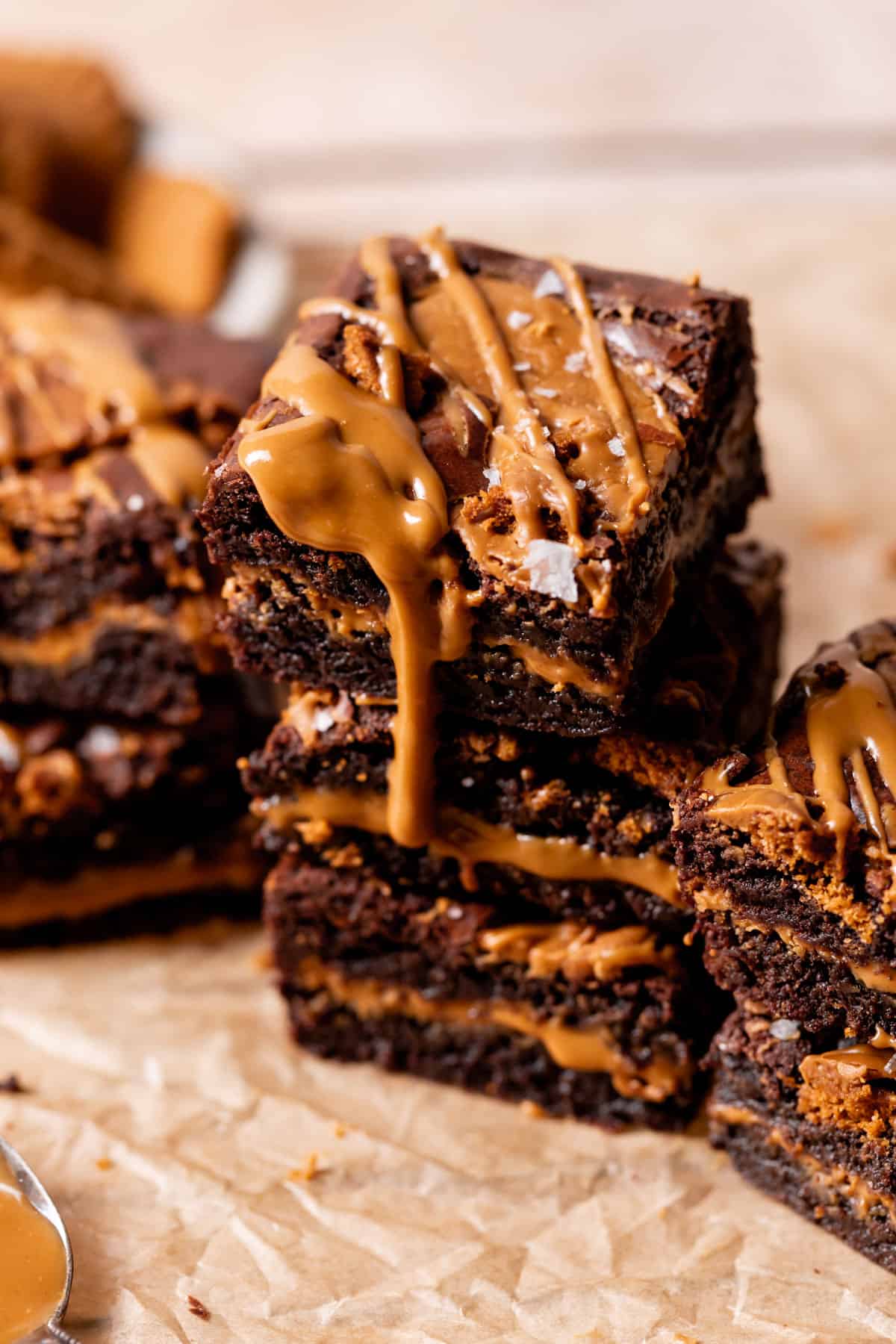 three biscoff brownies stacked on top of each other.