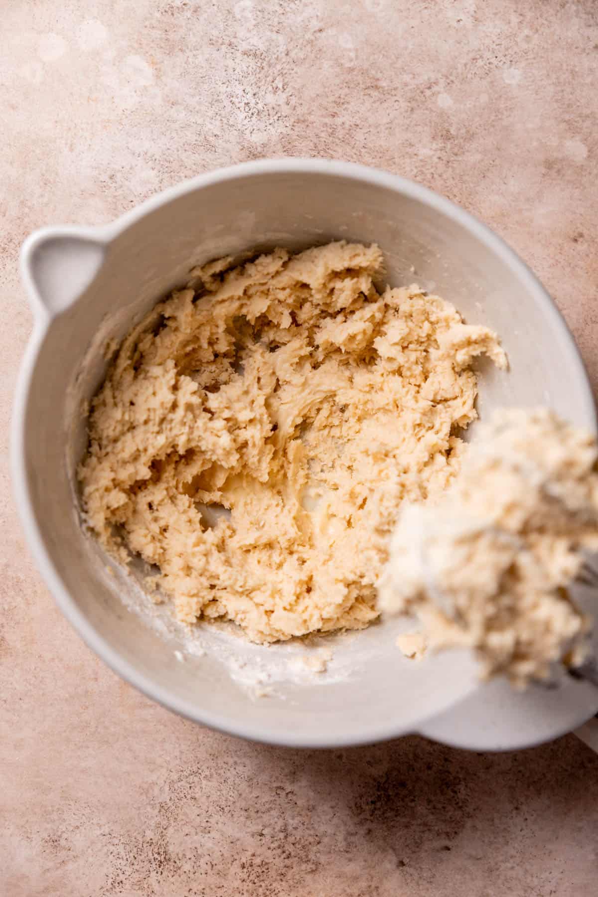 cookie dough in a mixing bowl after adding the dry ingredients.