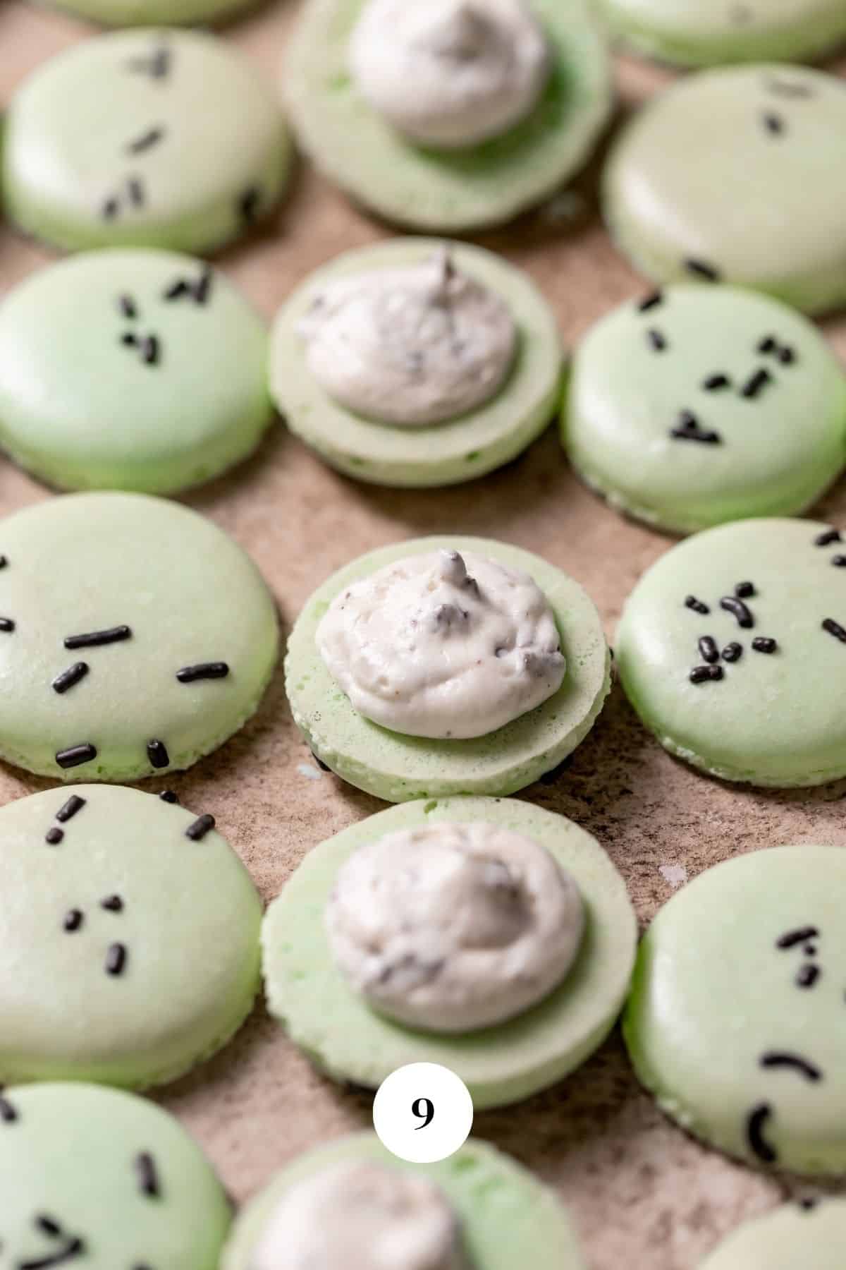 macaron shells with mint chocolate chip buttercream.