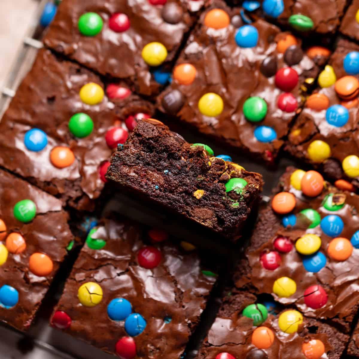 mm brownies on a wire rack with one on its side to show the texture.