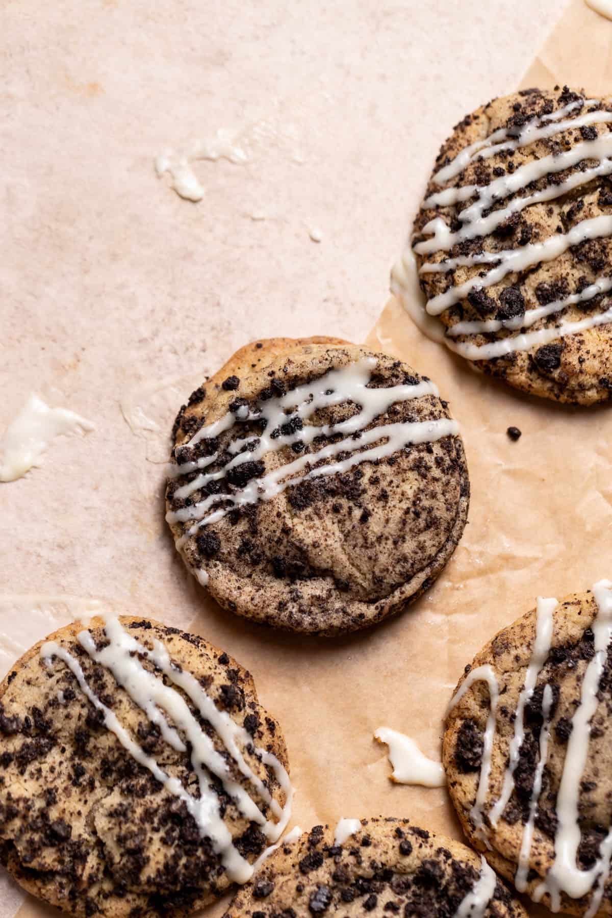 oreo cookies with cheesecake filling and glaze drizzled on top.