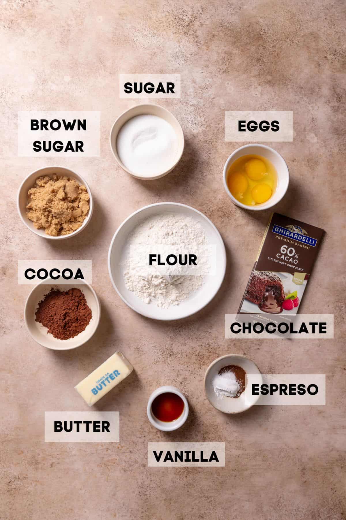 ingredients needed to make brownie cookies in bowls with labels.