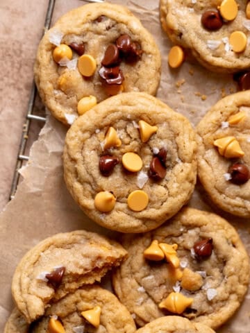 butterscotch cookies with chocolate chips on parchment paper.