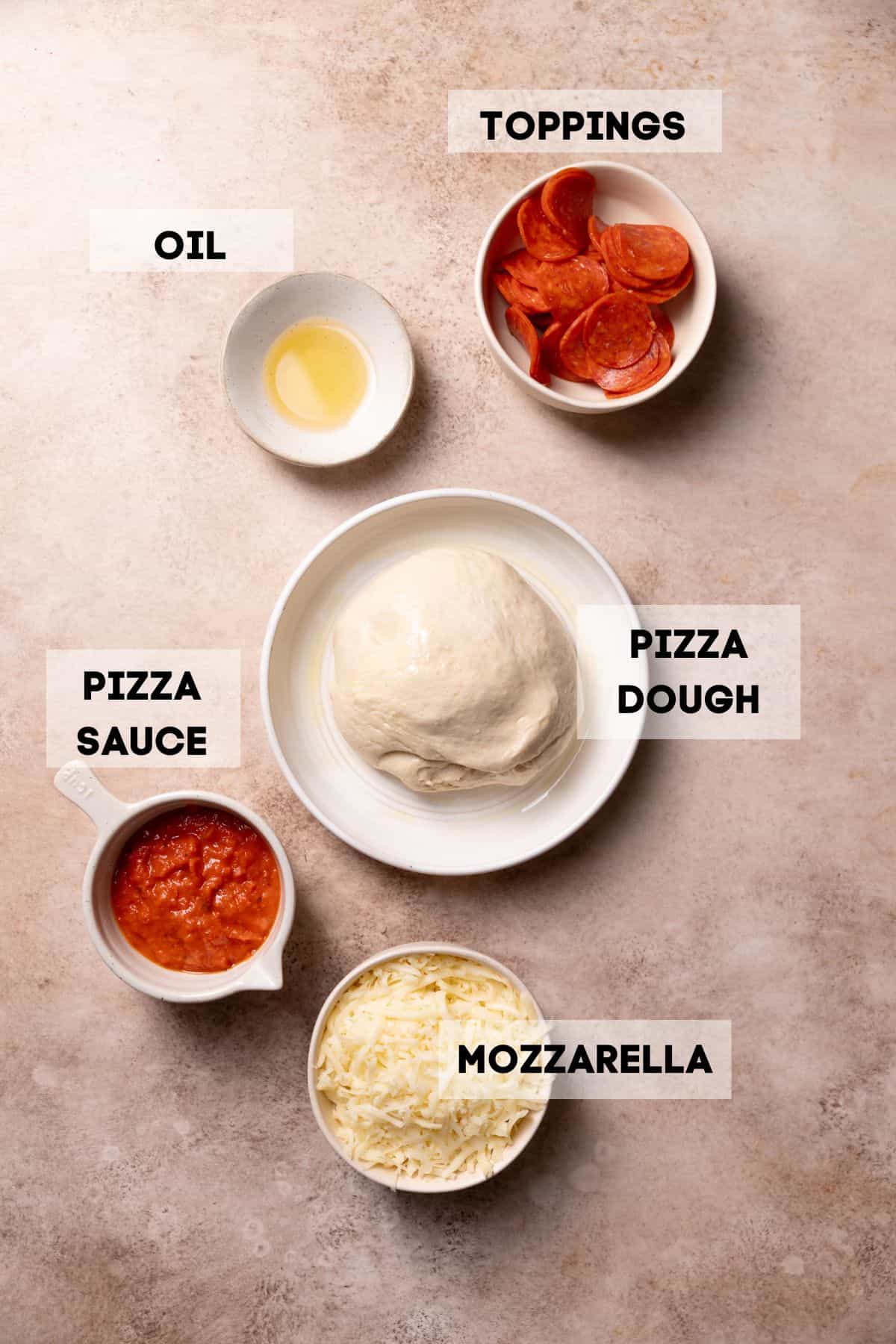 ingredients needed to make pizza in a cast iron skillet.