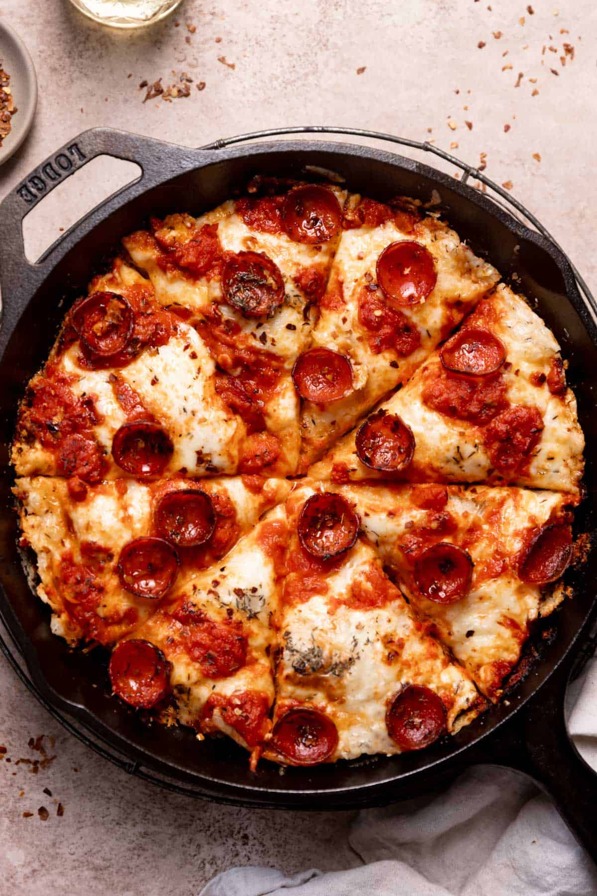 pepperoni skillet pizza cut into slices.