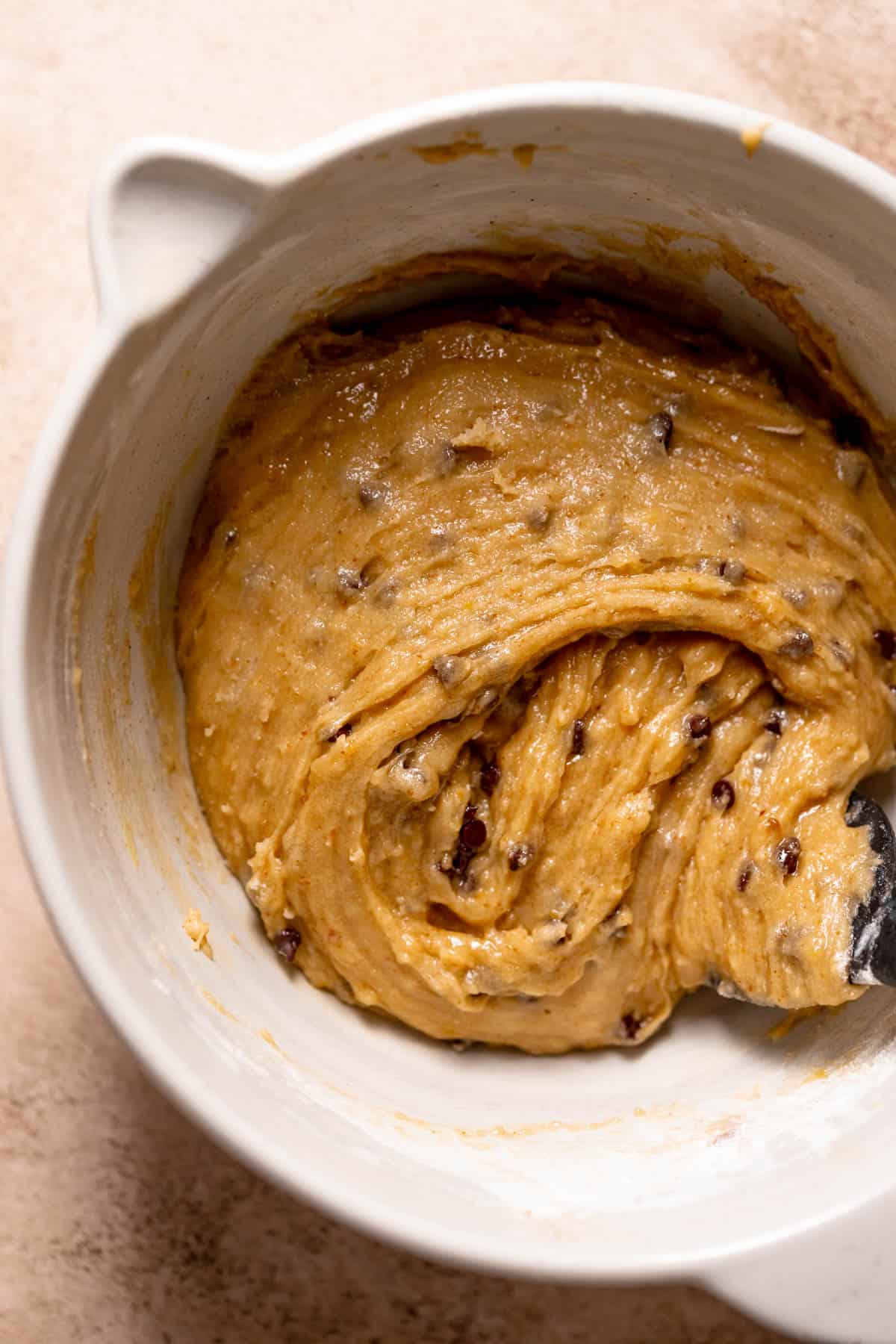 chocolate chip cookie dough in a mixing bowl.
