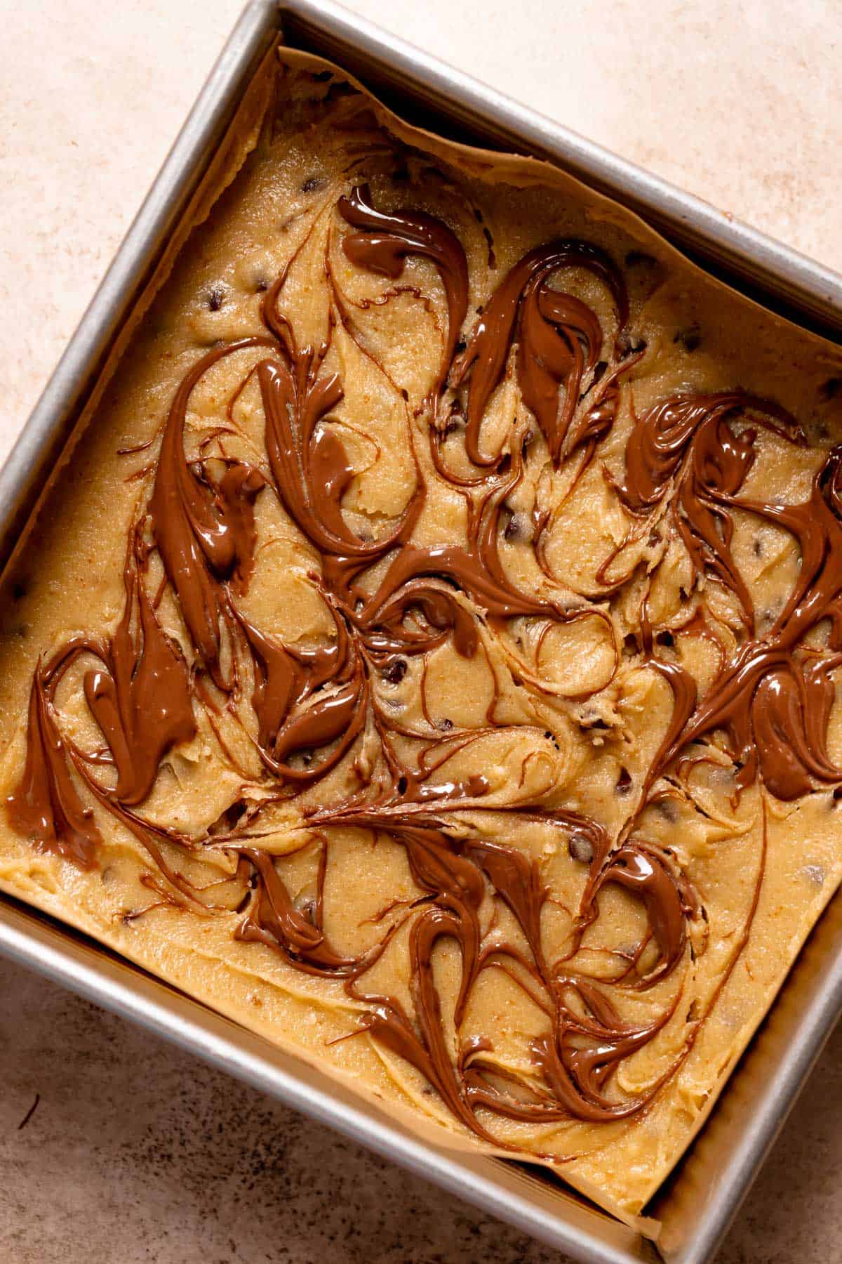 the top of the nutella bars swirled with melted nutella before baking.