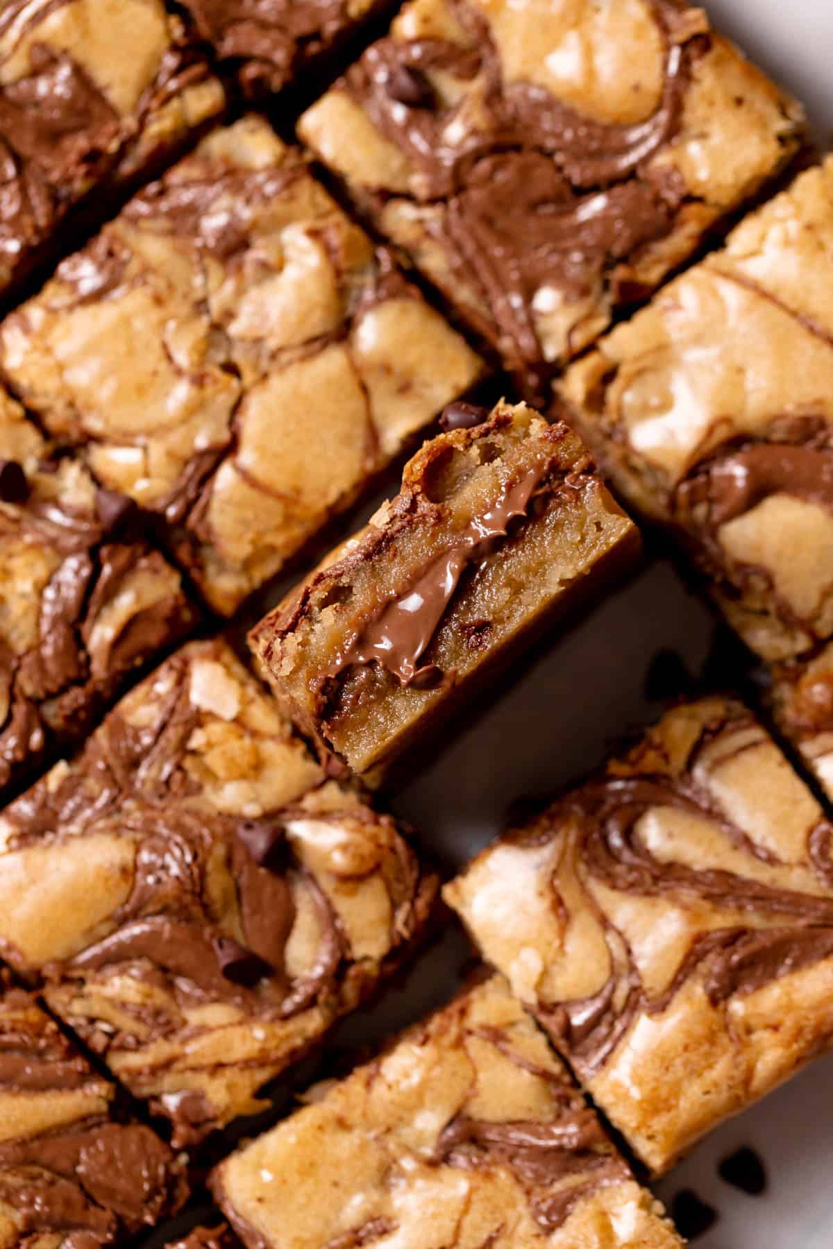 cookie bars stuffed with nutella on white parchment paper.