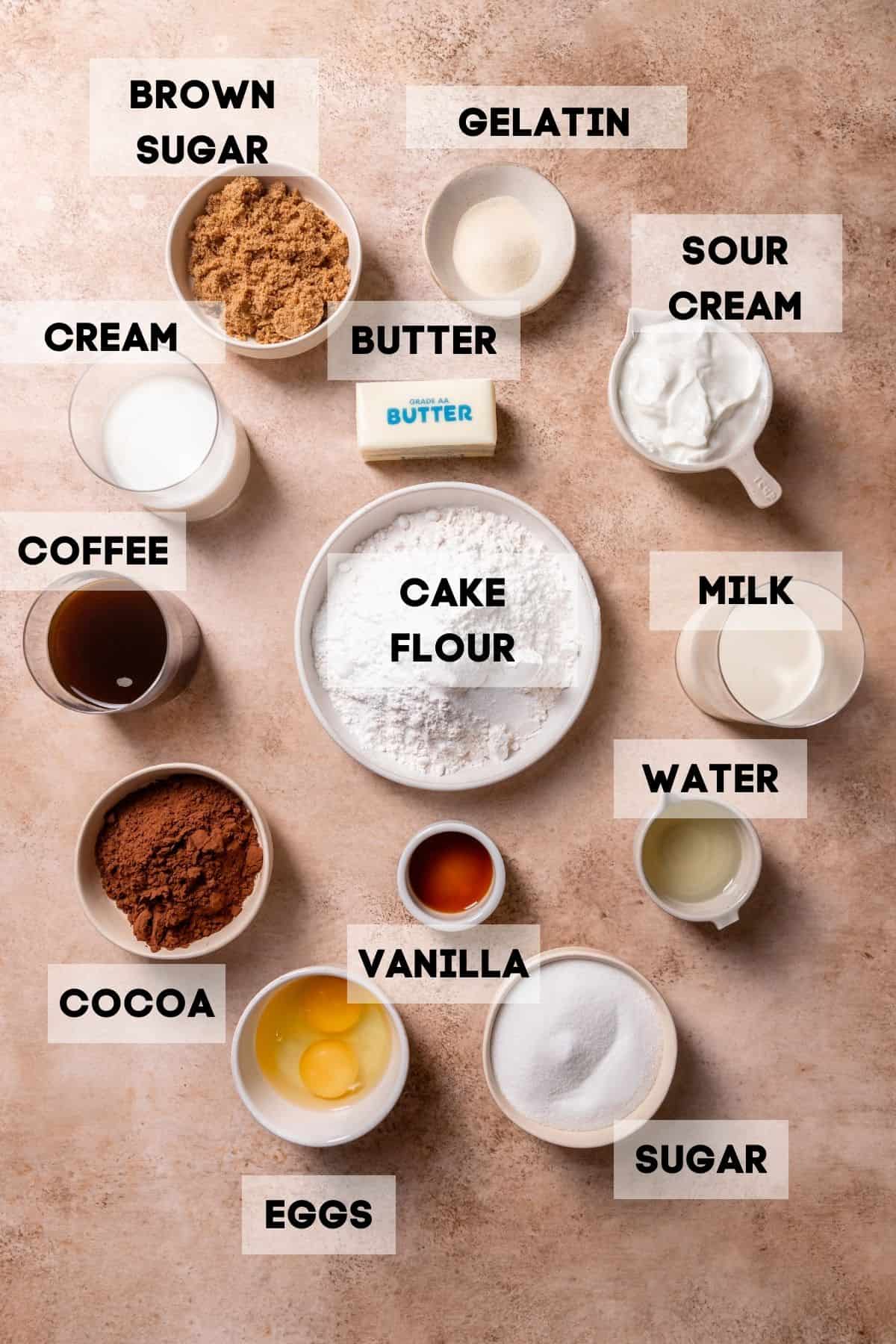 Ingredients to make ding dong cake in bowls with labels.