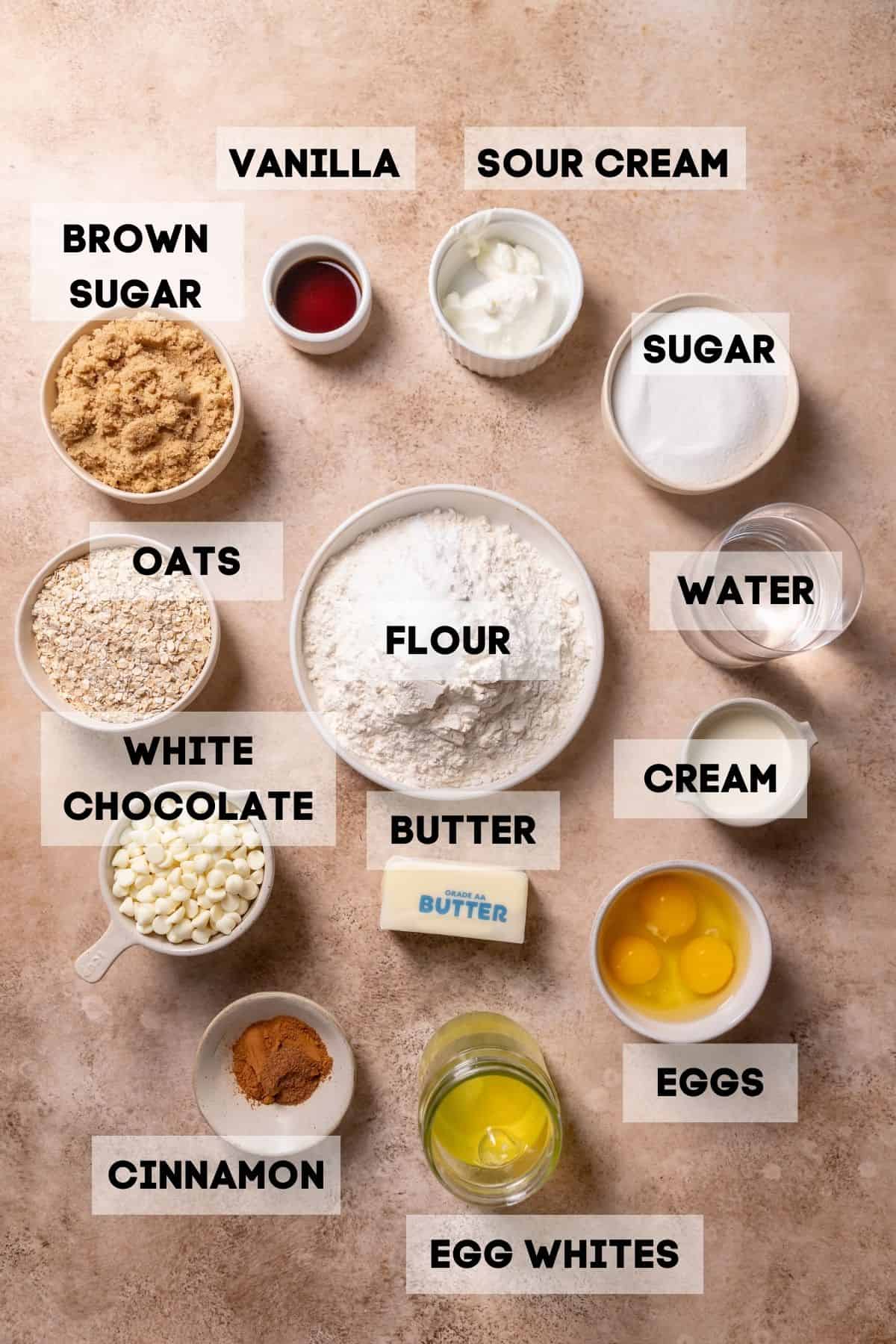 ingredients needed to make oatmeal cream pie cake in bowls with labels.