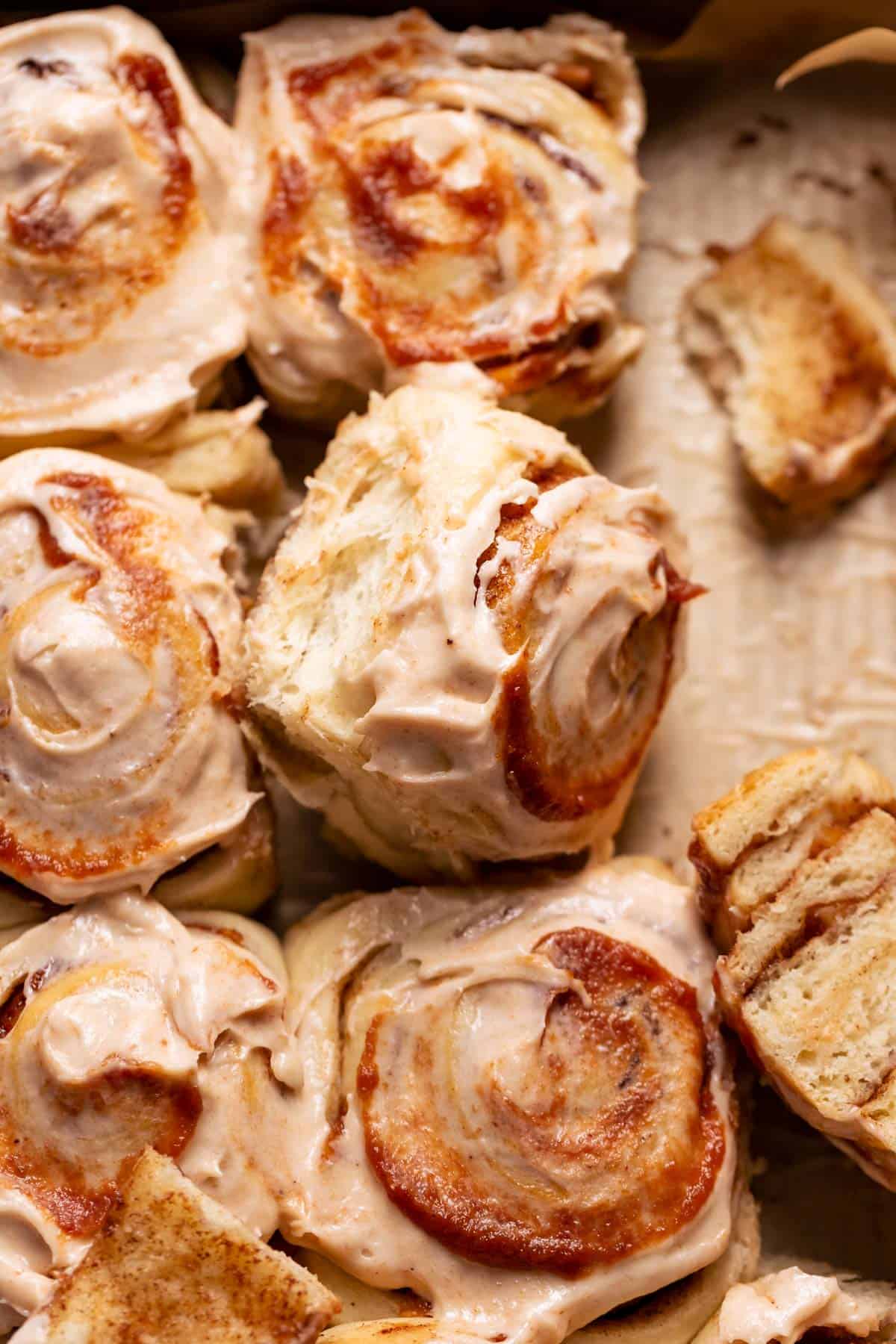 Apple cinnamon rolls with cream cheese icing and apple butter on top.