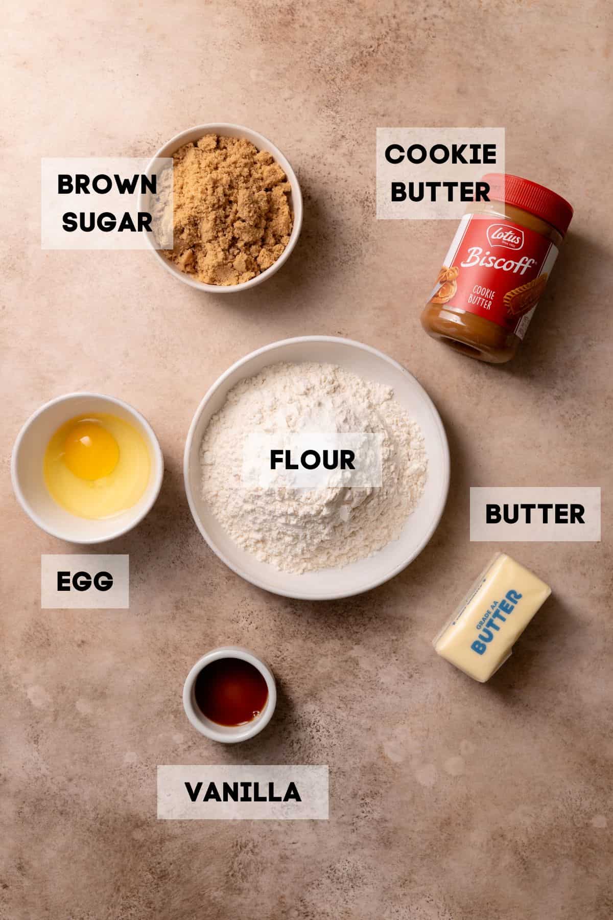Biscoff butter cookie ingredients in bowls with labels.