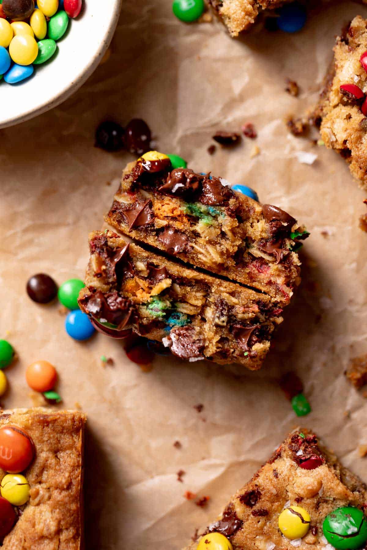 A cookie bar broken in half to show the chewy oatmeal texture.