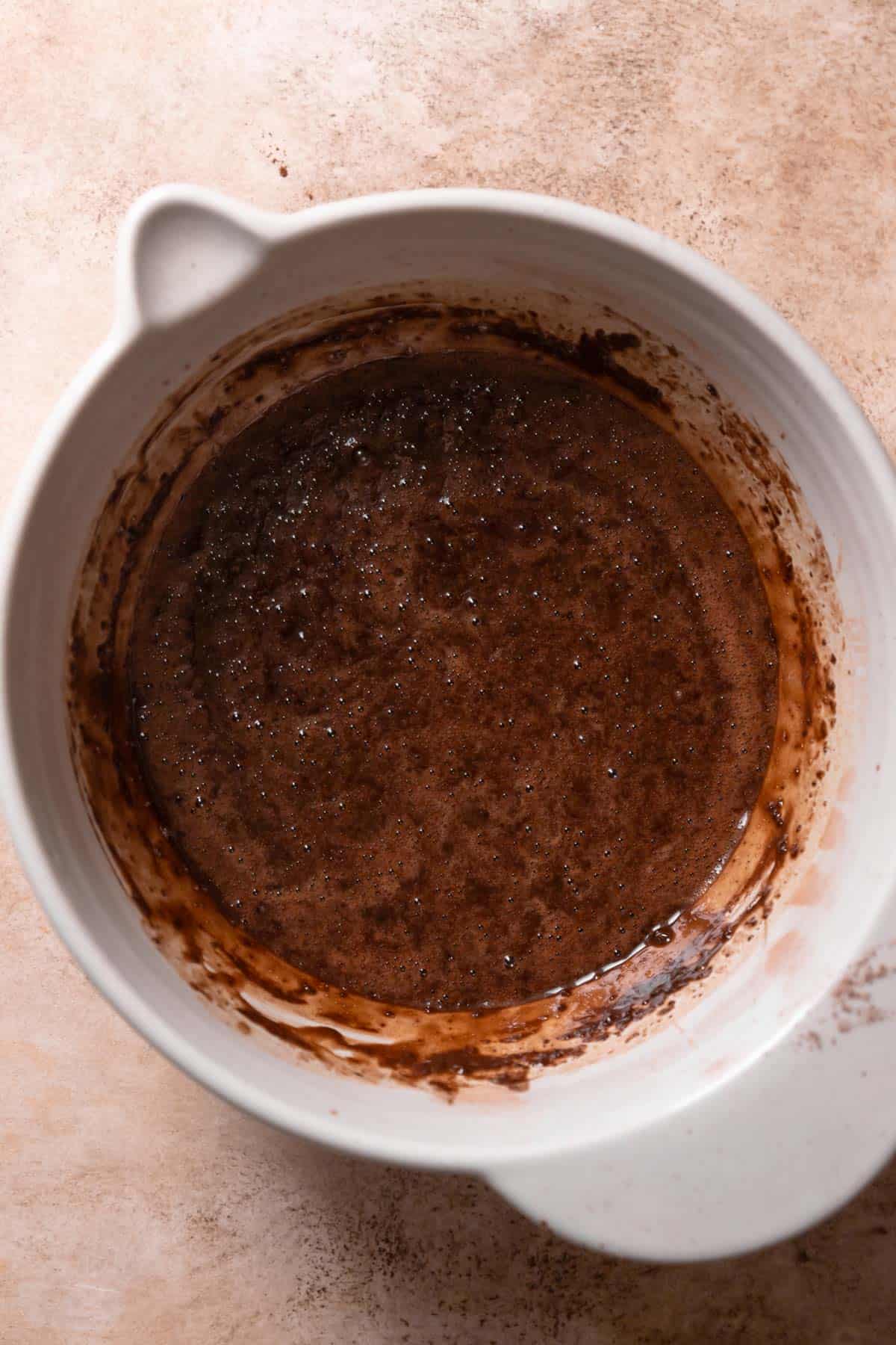 A mixing bowl with chocolate cake batter.