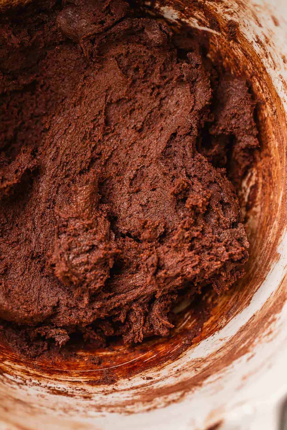 Dark chocolate cookie dough in a mixing bowl.