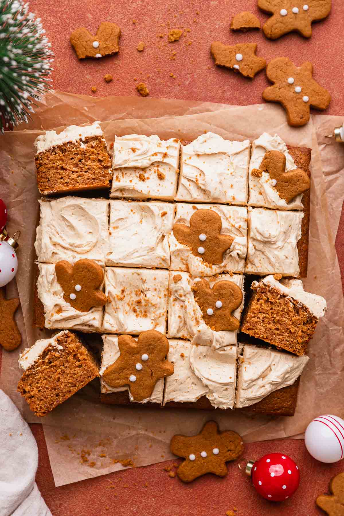 Decorated christmas gingerbread cake with mini gingerbread cookies on top.