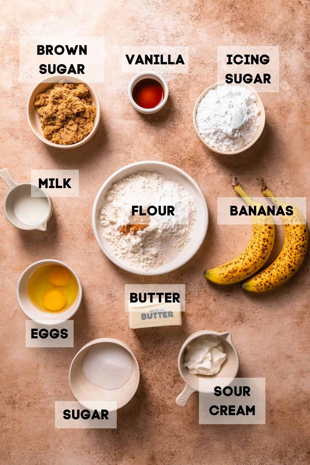 Ingredients needed to make browned butter banana bread in bowls with labels.