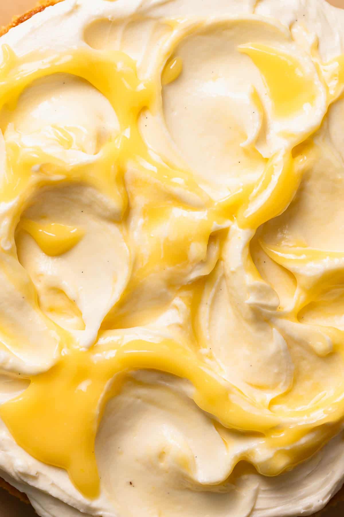 Close up shot of the swirled cream cheese frosting and lemon curd.