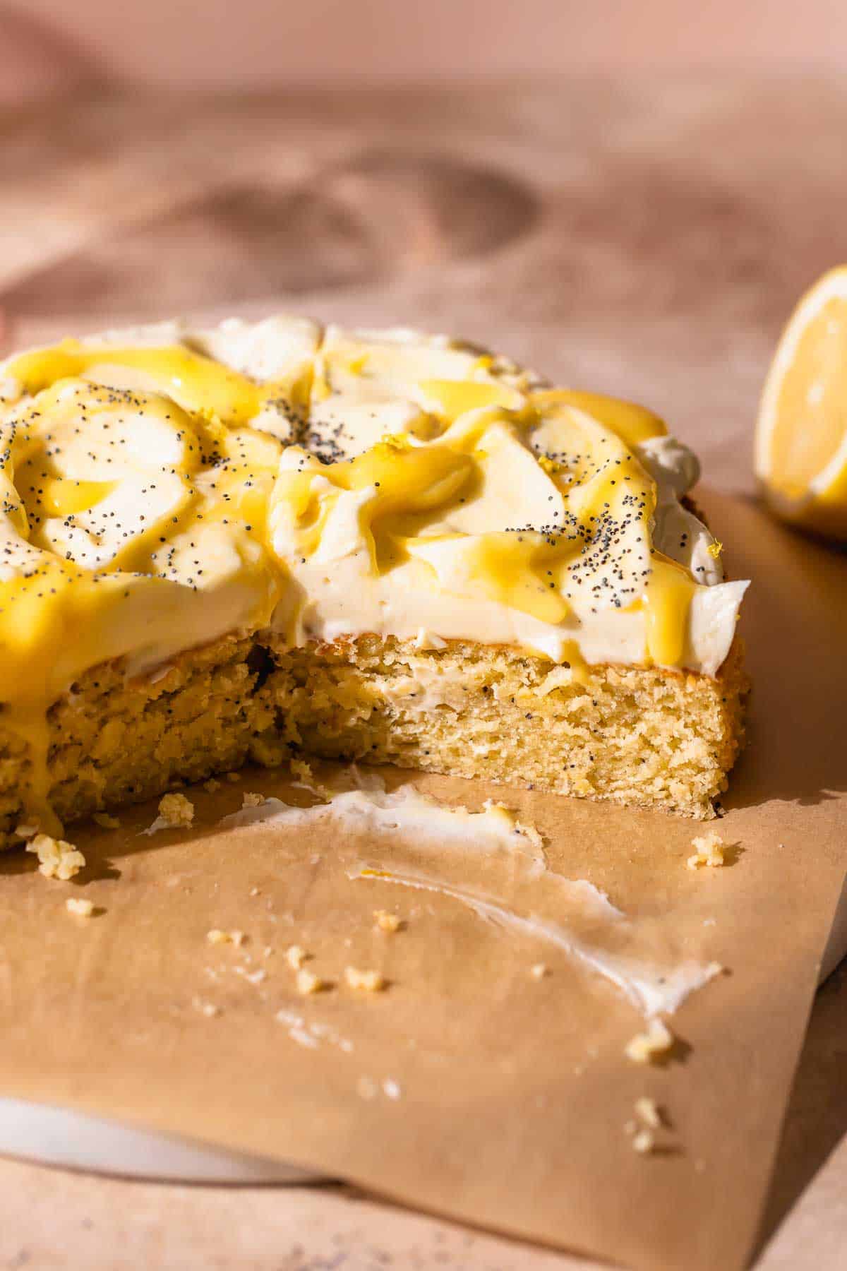 Lemon poppy seed cake with cream cheese frosting and lemon curd on top.