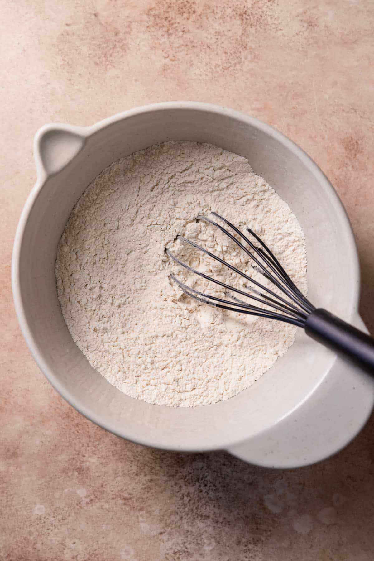 A mixing bowl with the whisked dry ingredients for the muffin batter.