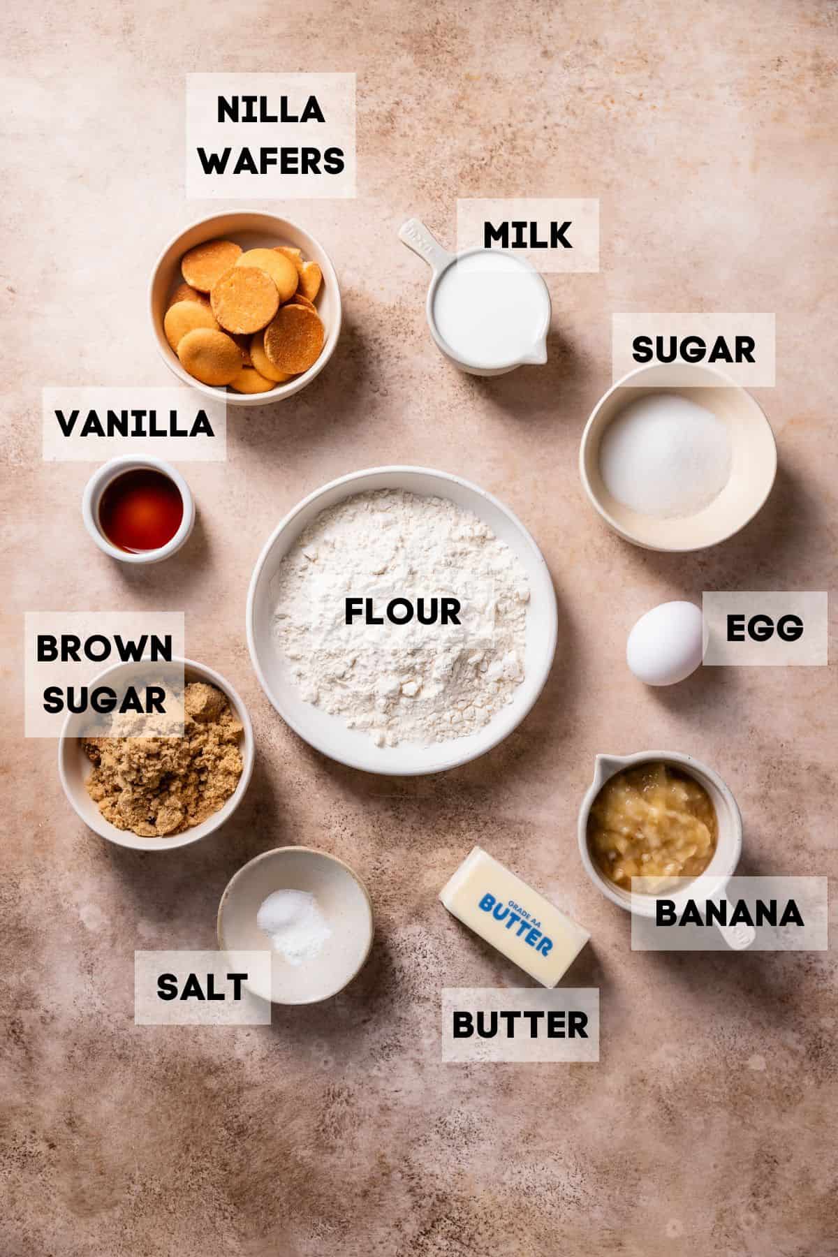 Ingredients needed to make pudding brownies in bowls with labels.