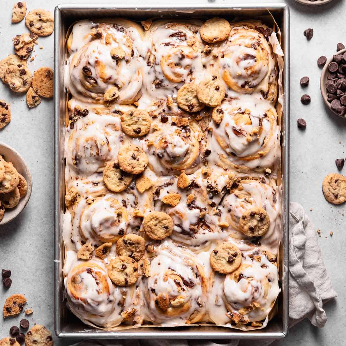 Chocolate chip cookie stuffed cinnamon rolls with vanilla glaze.