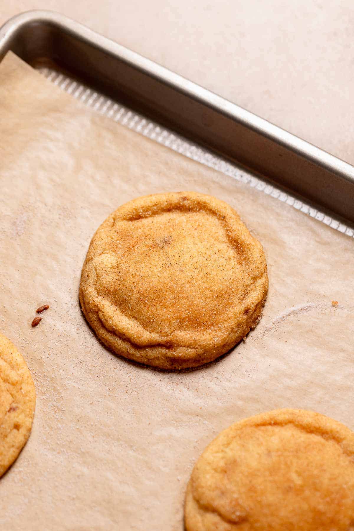 Brown butter snickerdoodles on a baking sheet after baking.