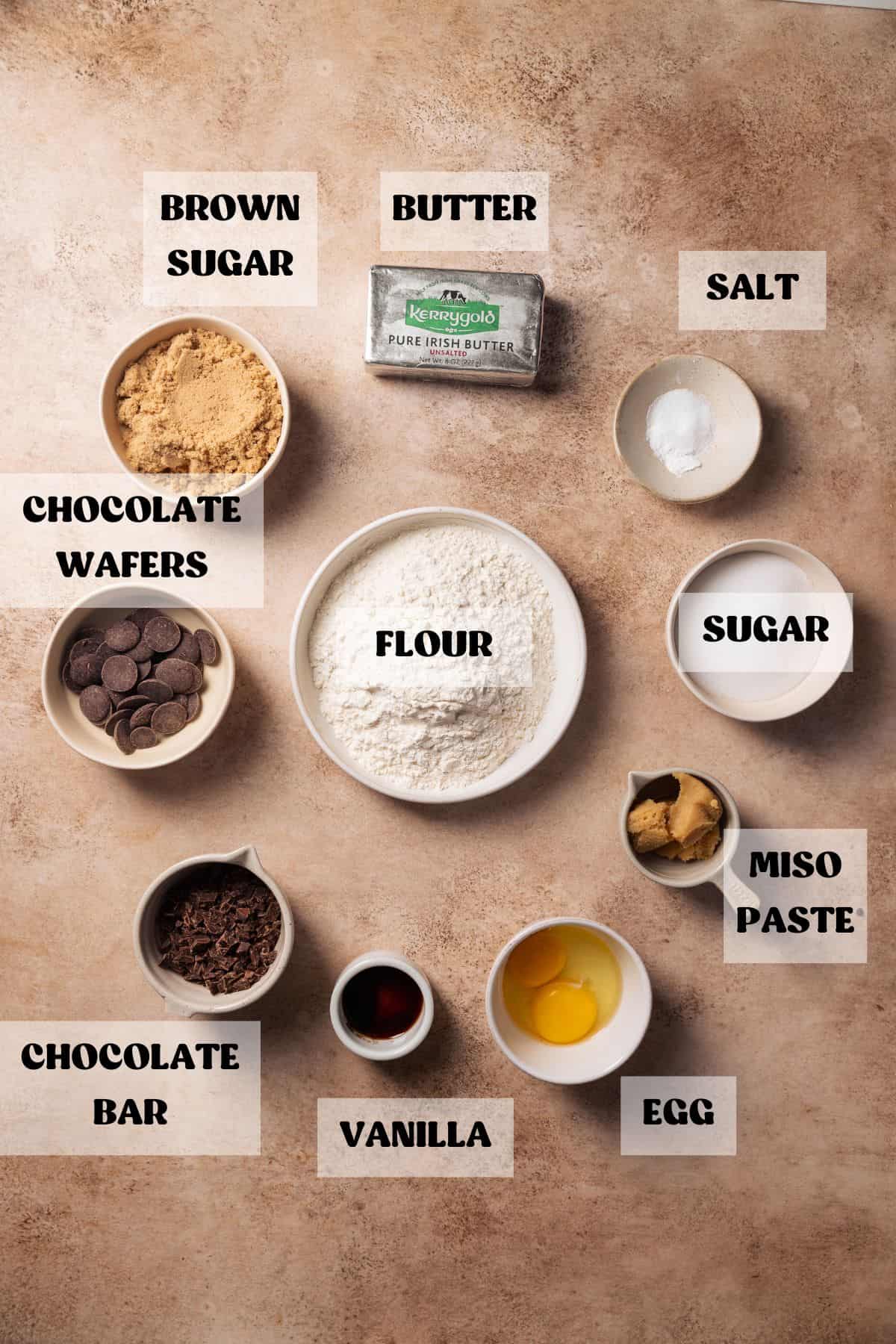 Ingredients needed to make cookies with miso in bowl with labels.