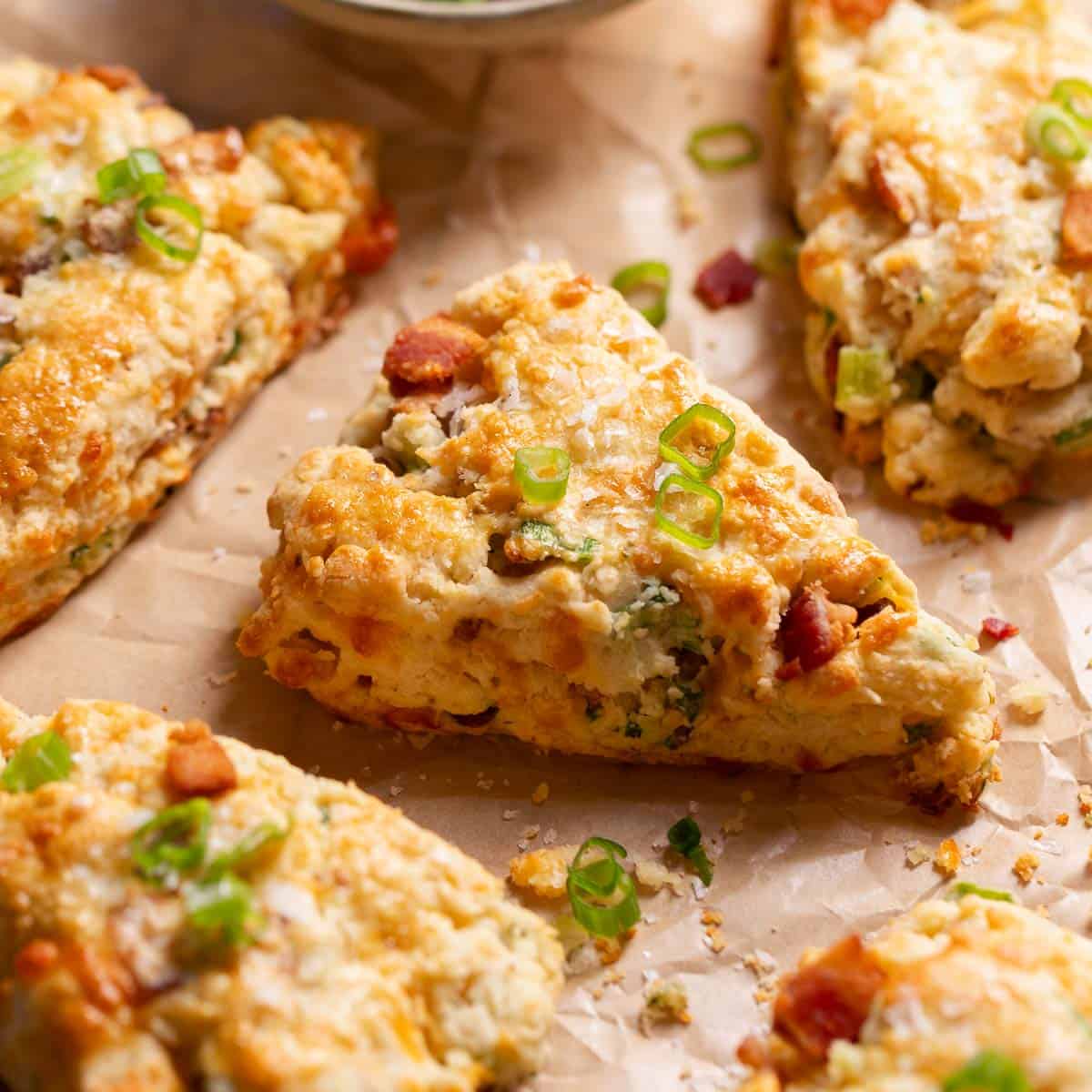 Savory bacon cheddar scones on parchment paper.