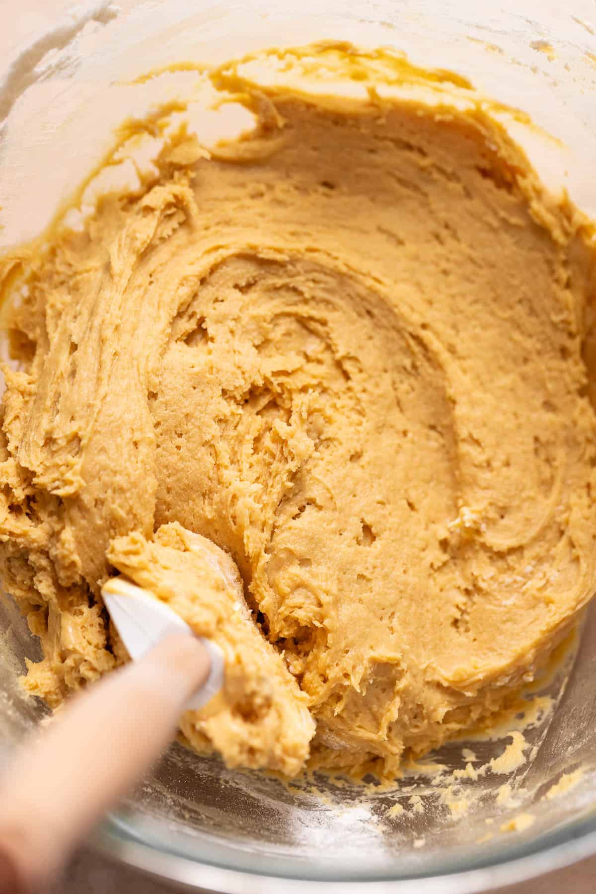 A mixing bowl with the snickerdoodle cookie dough.