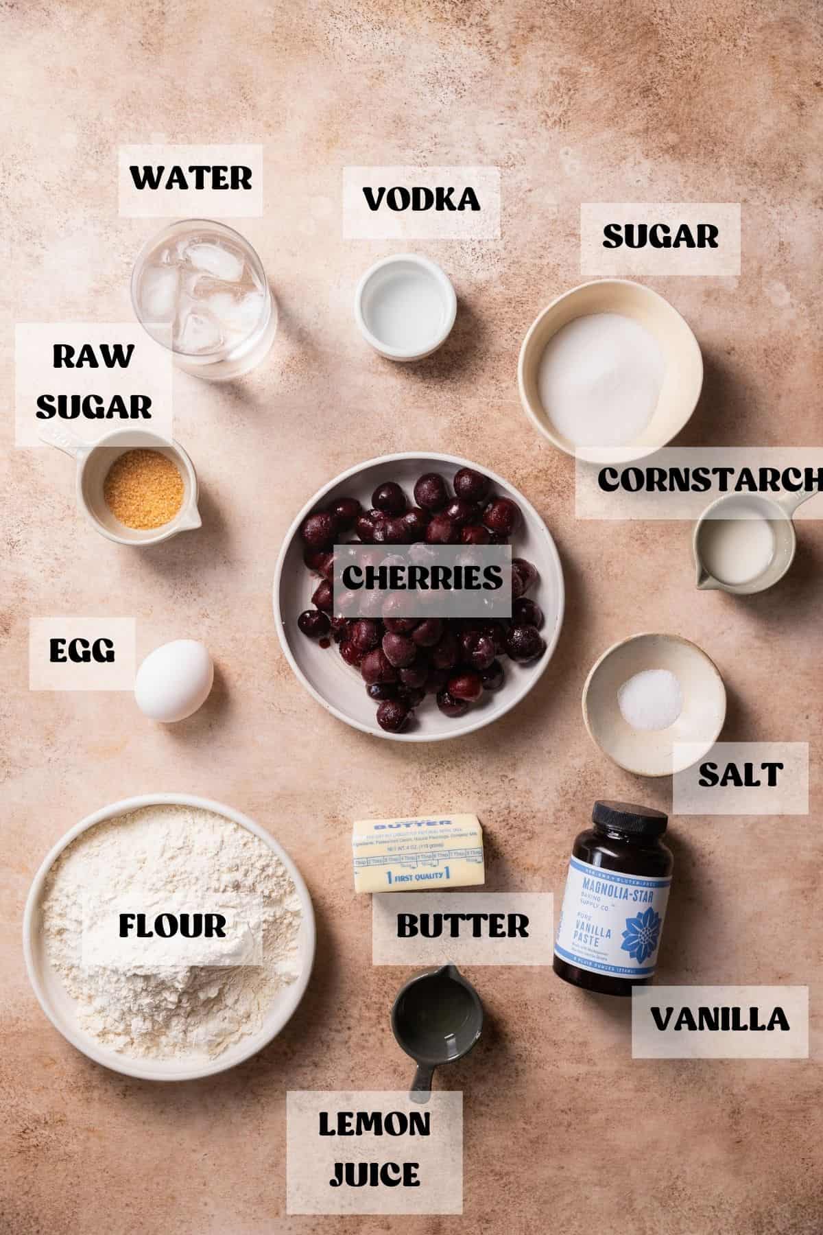 Ingredients needed to make cherry bars in bowls with labels.