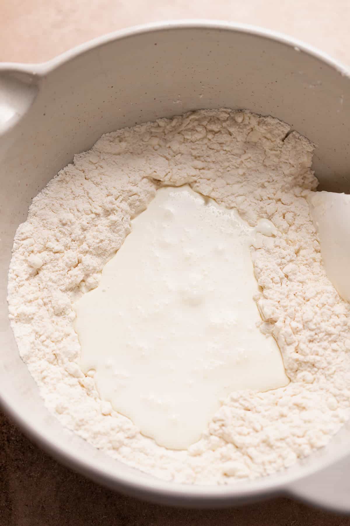 Heavy cream poured into the center of the dry ingredients before mixing.