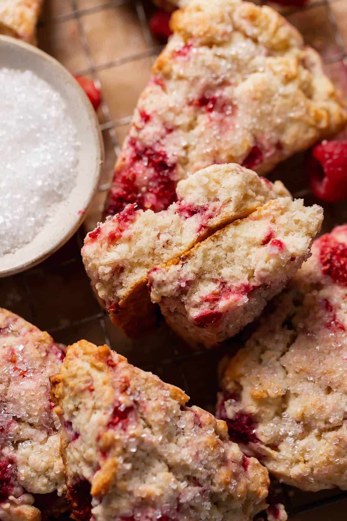 Raspberry scone cut in half to show the super soft and tender texture.