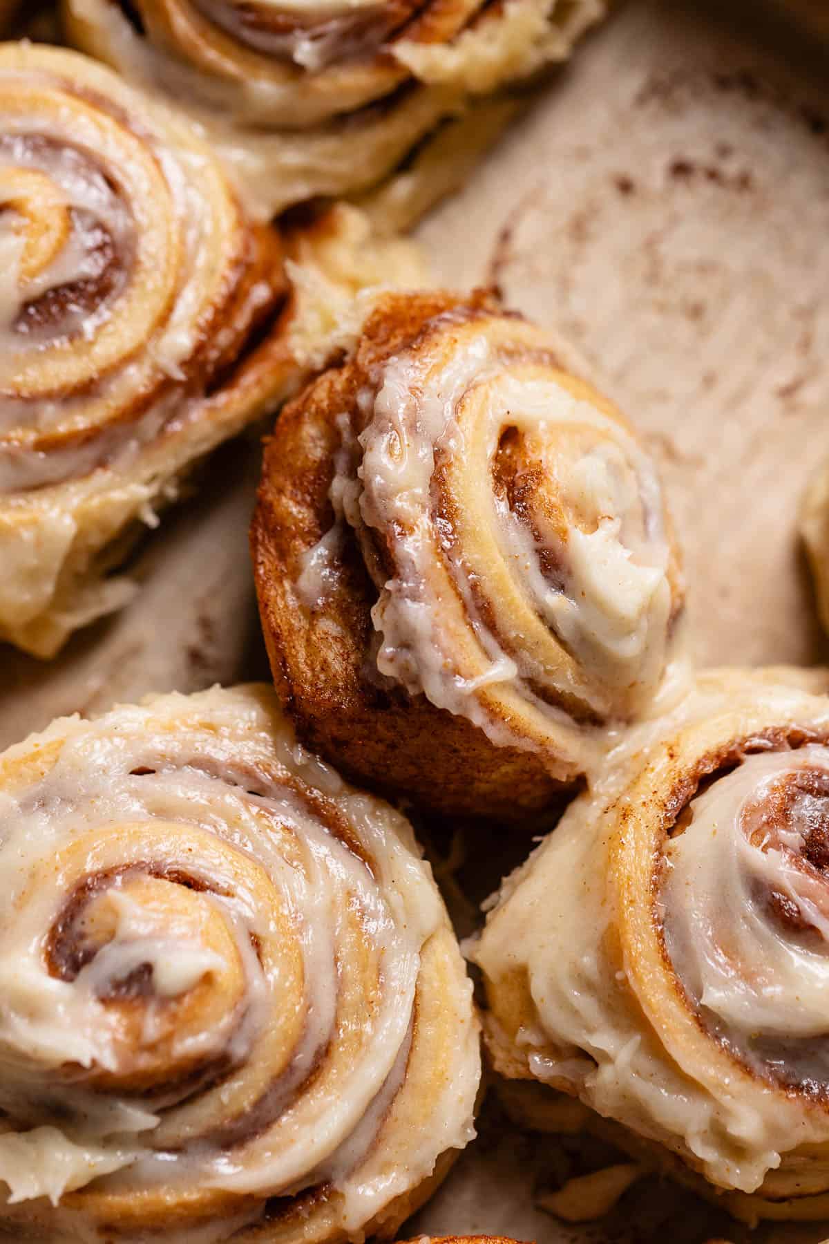 Browned butter cinnamon rolls in a baking pan.