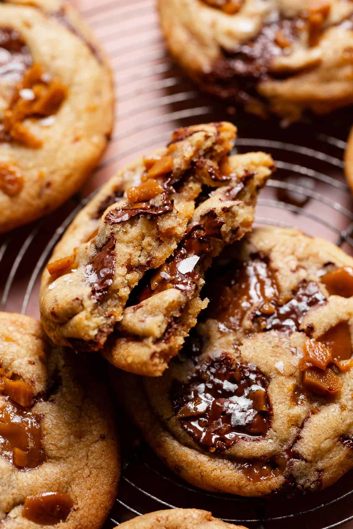 Toffee brown butter cookie broken in half to show the texture.