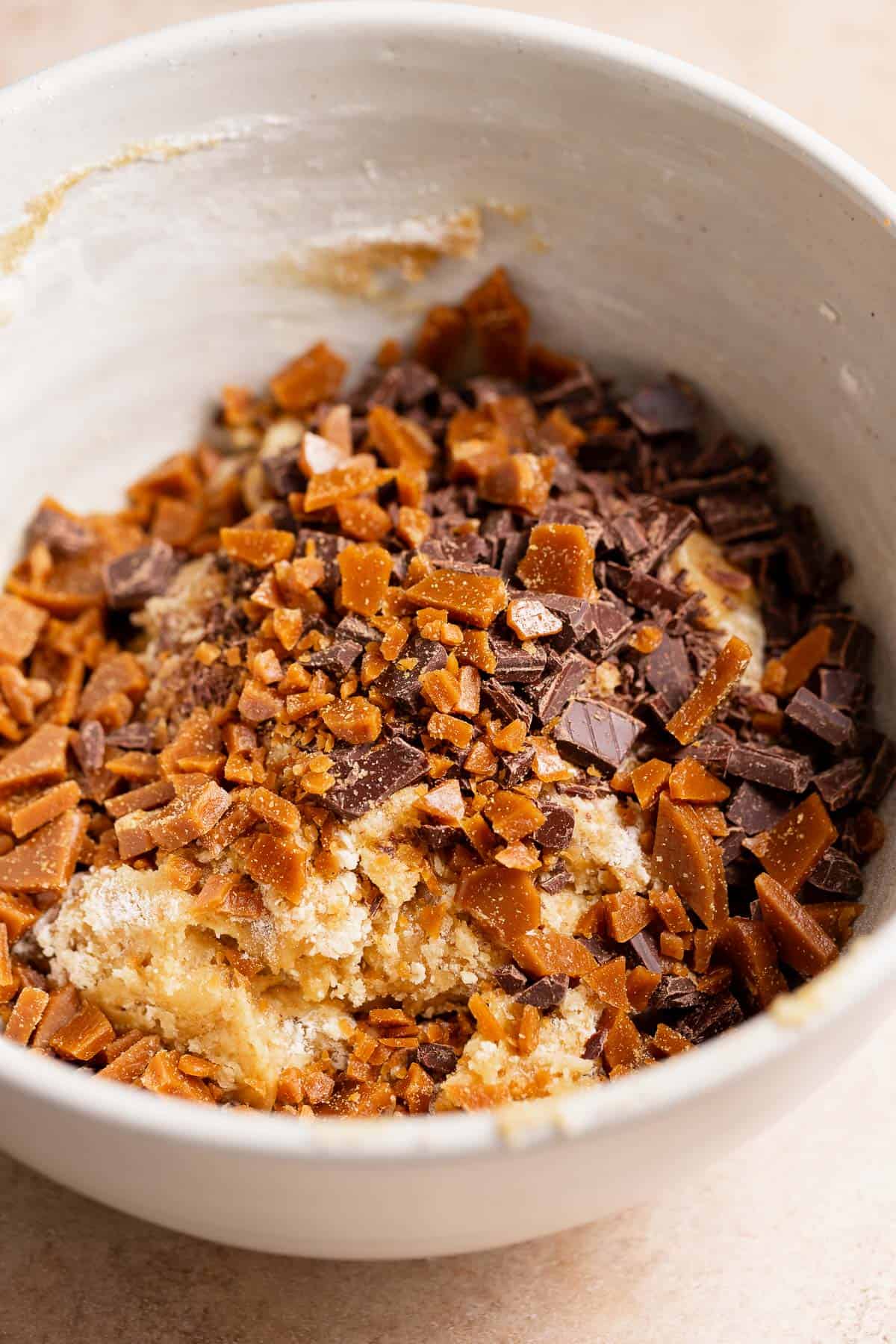 A bowl with the brown butter cookie dough before adding the toffee bits and chocolate chips.