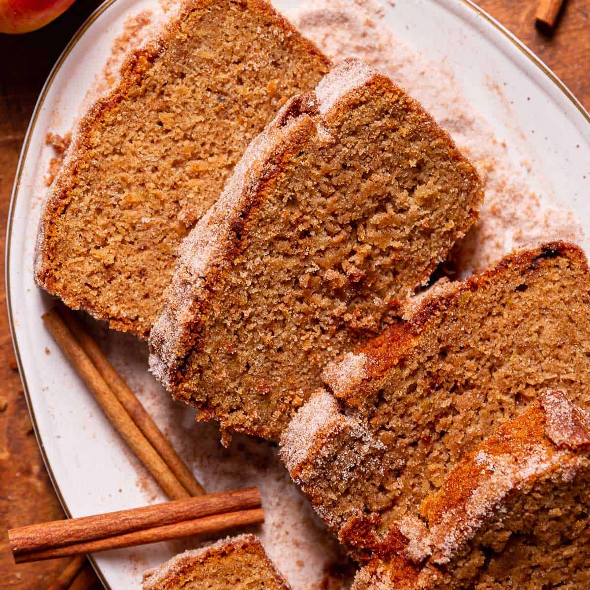 Slices of spiced apple cider cake on a white plate.