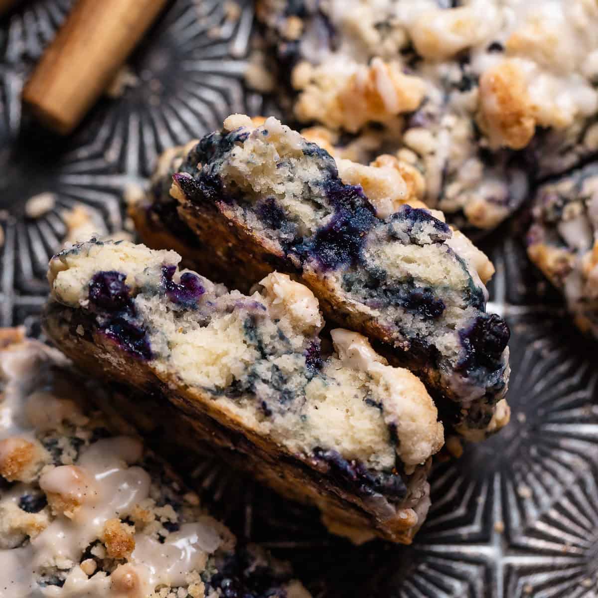 A blueberry scone cut in half to show the moist and tender texture.