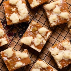 Salted caramel apple bars on a wire cooling rack.