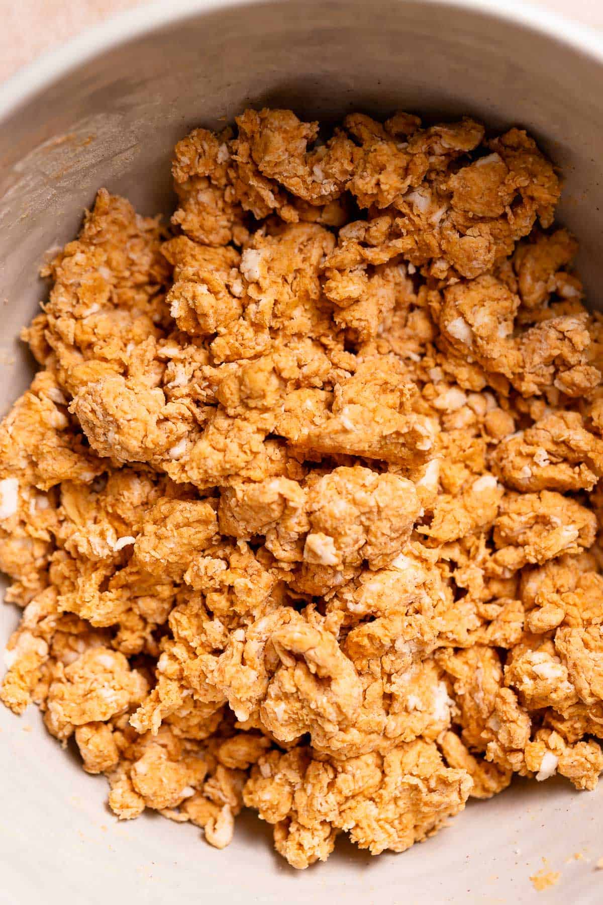 Pumpkin scone dough in a mixing bowl before shaping.