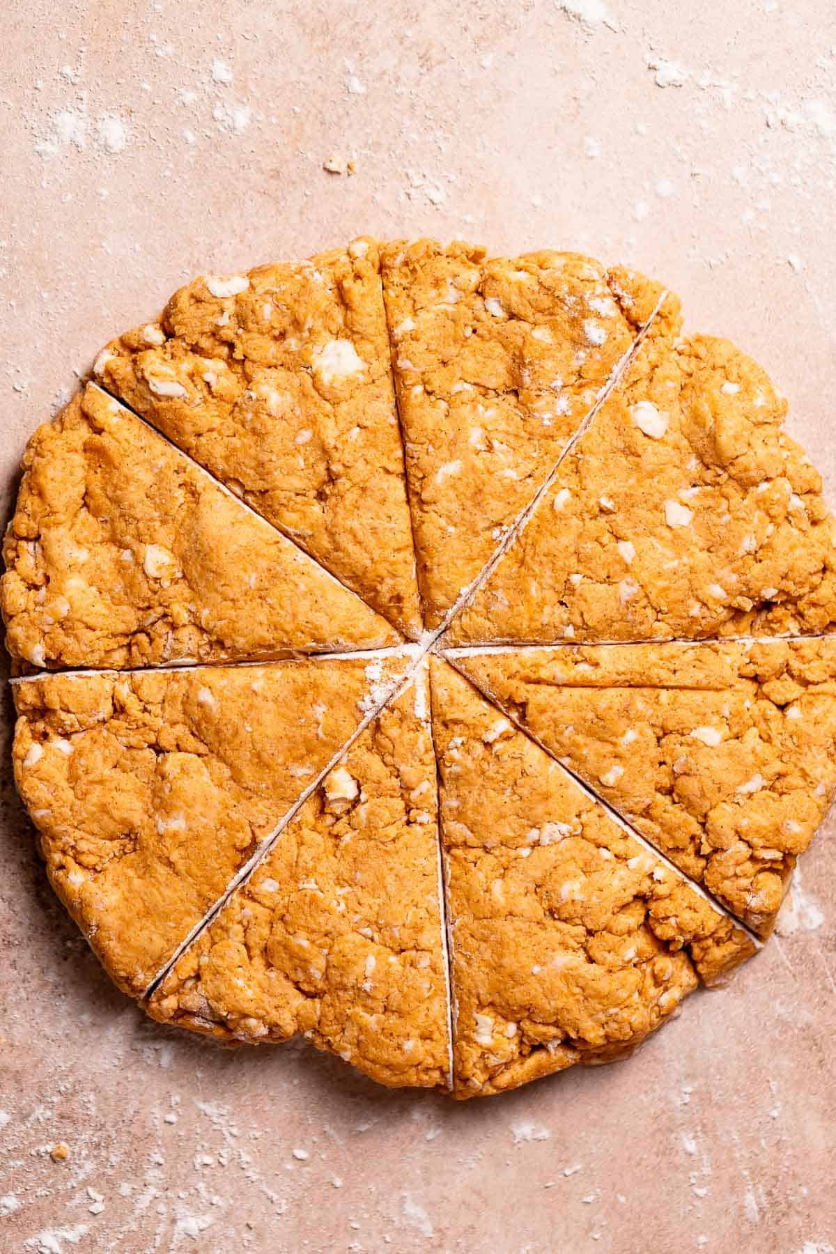 Scone dough cut into eight segments.