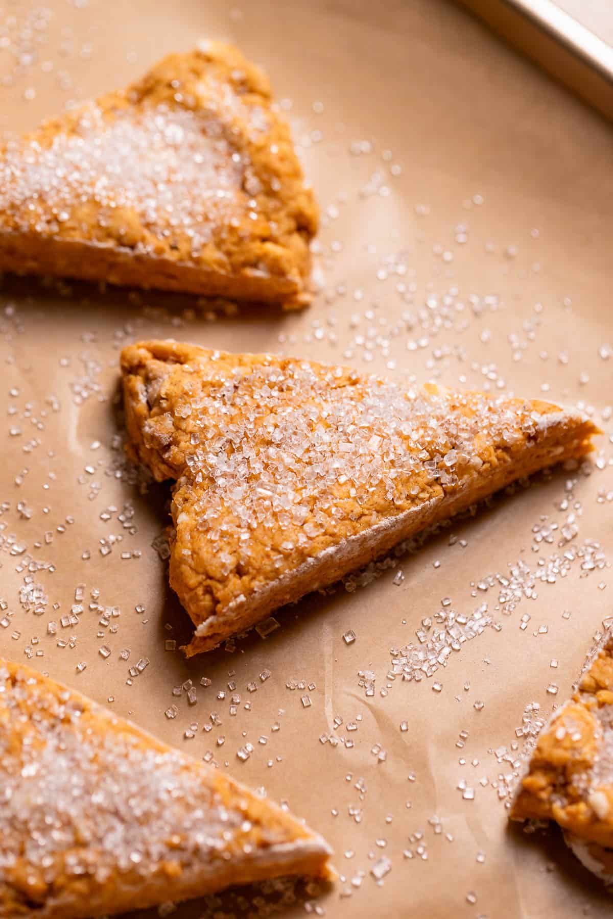 Pumpkin scones with sparkling sugar on top before baking.