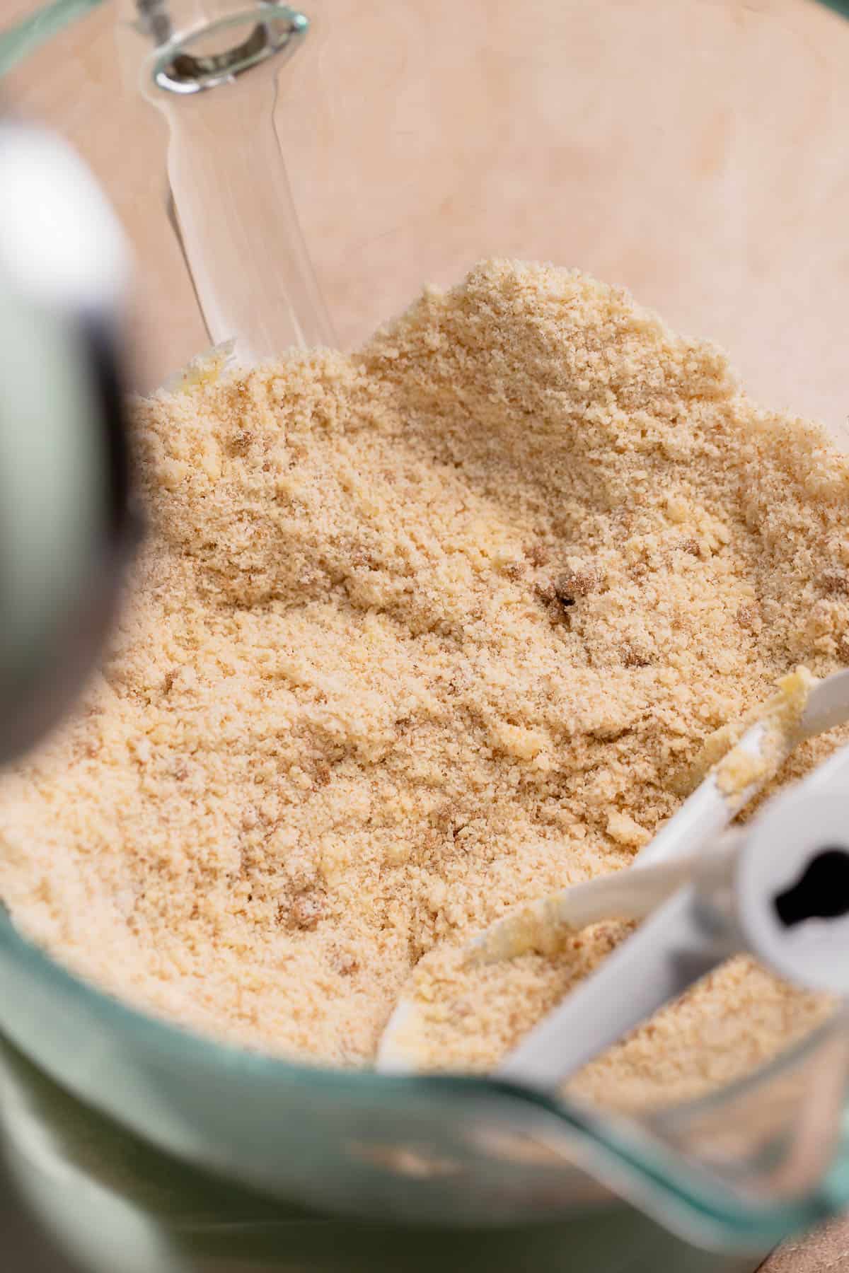 A mixing bowl with the dry ingredients and butter mixed together.