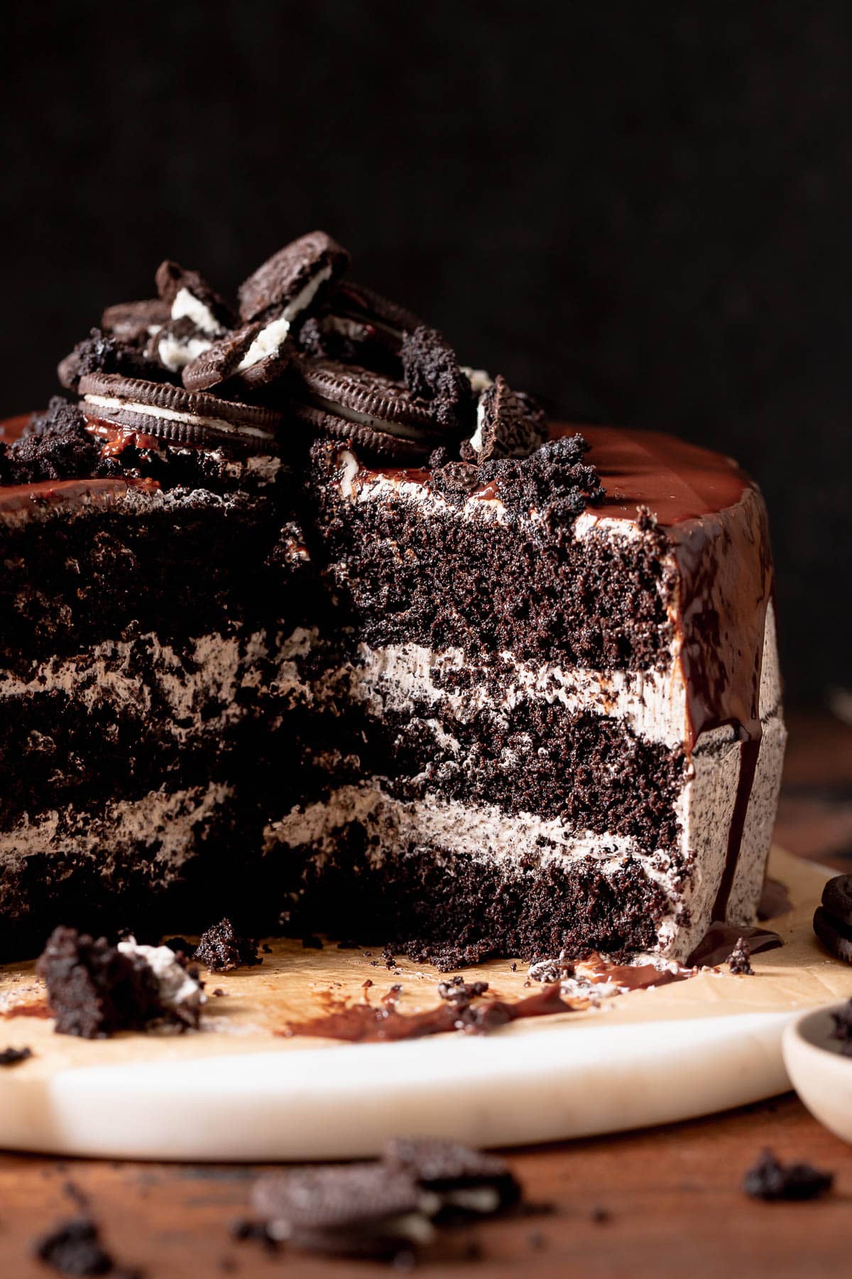 Oreo layer cake cut in half to show the moist texture.