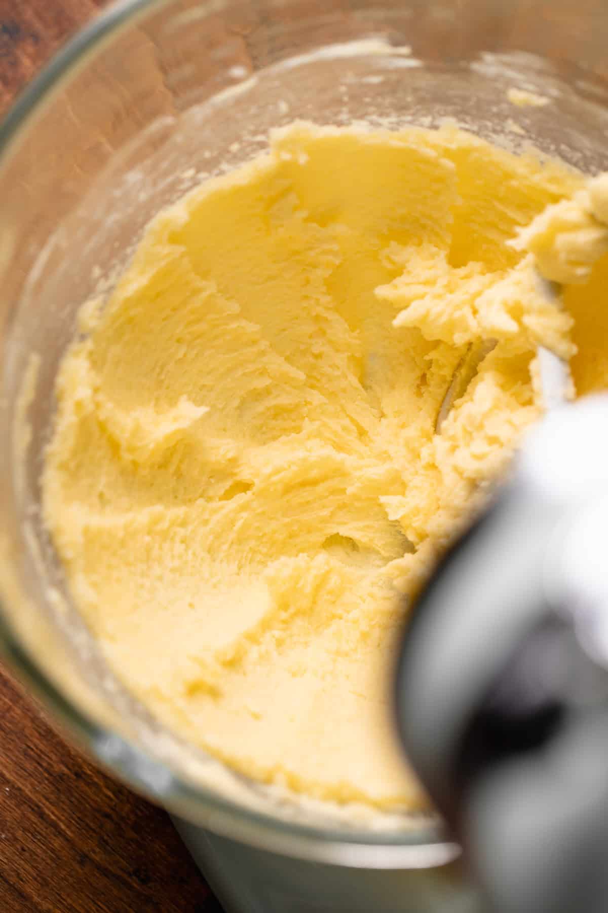 Creamed butter in a mixing bowl.