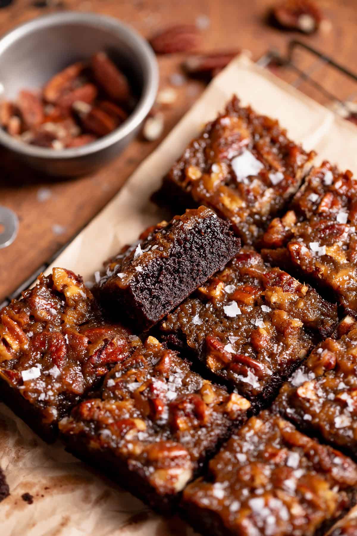 Pecan pie topped brownies cut into bars.