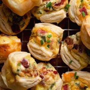 Mini quiches on a wire rack.