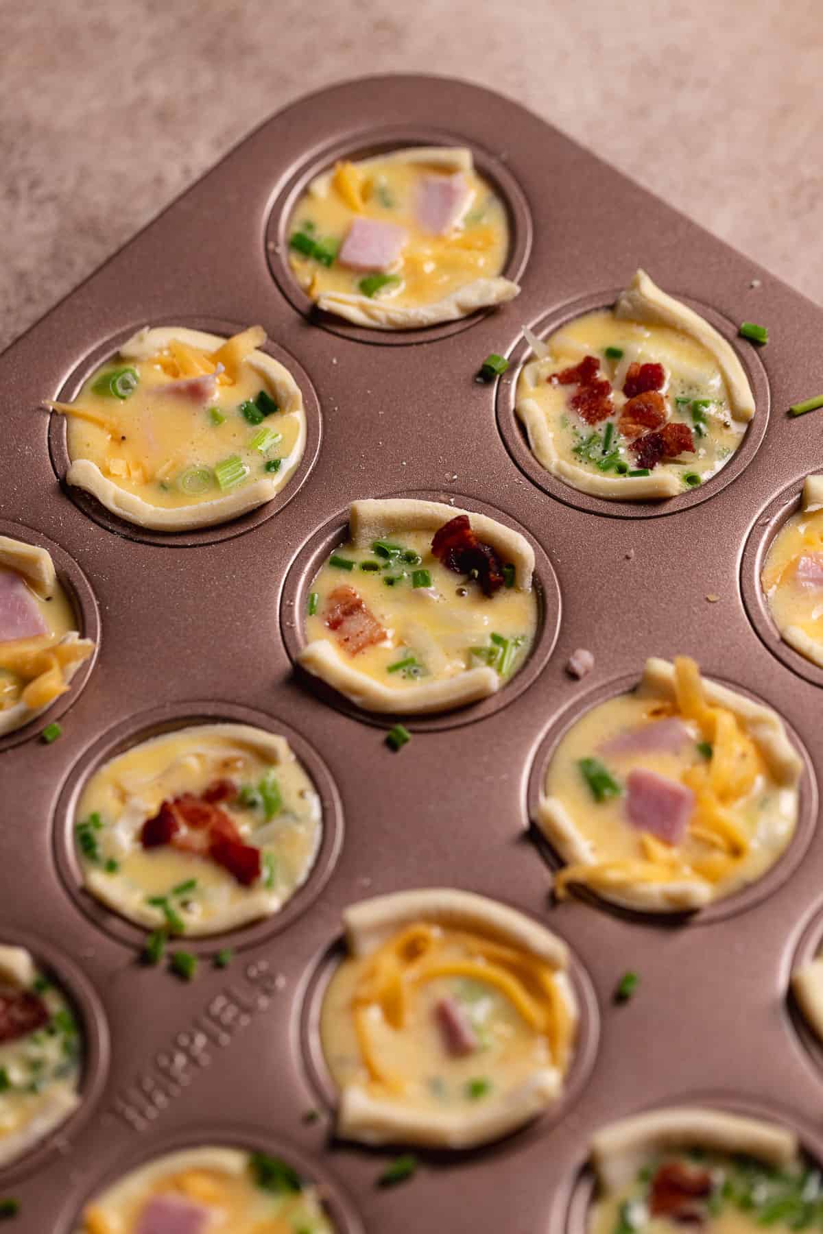 Mini quiches before baking.